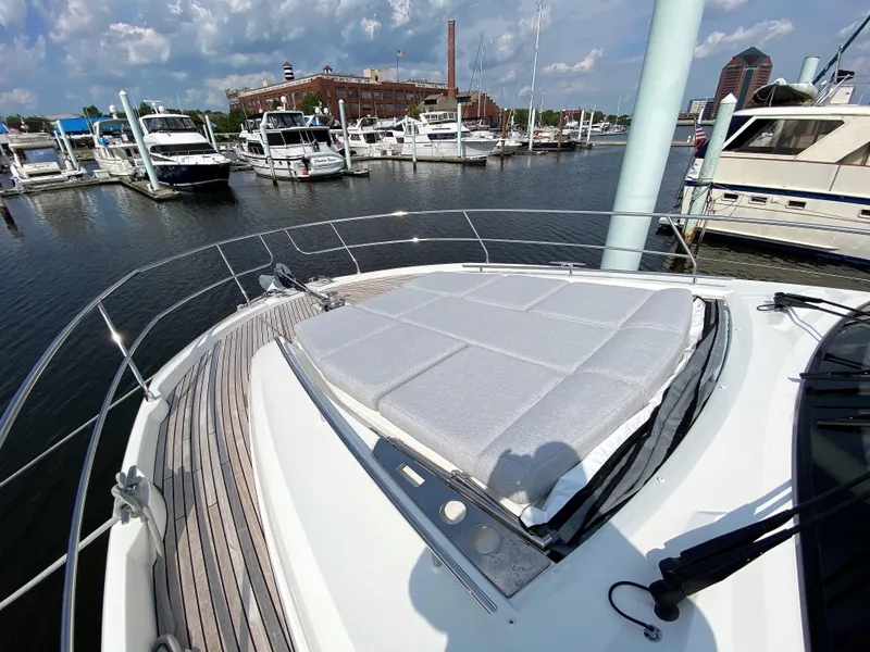 Slide: The Image of Prestige 520 S 2025 yacht docked at a marina with other boats. - 37