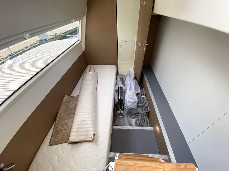 Slide: The Image of 2025 Prestige 520 S yacht interior storage area with mattress and equipment. - 4