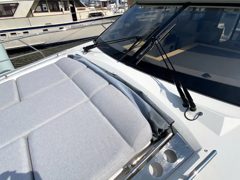 Slide: The Image of Prestige 520 S 2025 yacht with sunbathing area and windshield wipers. - 40