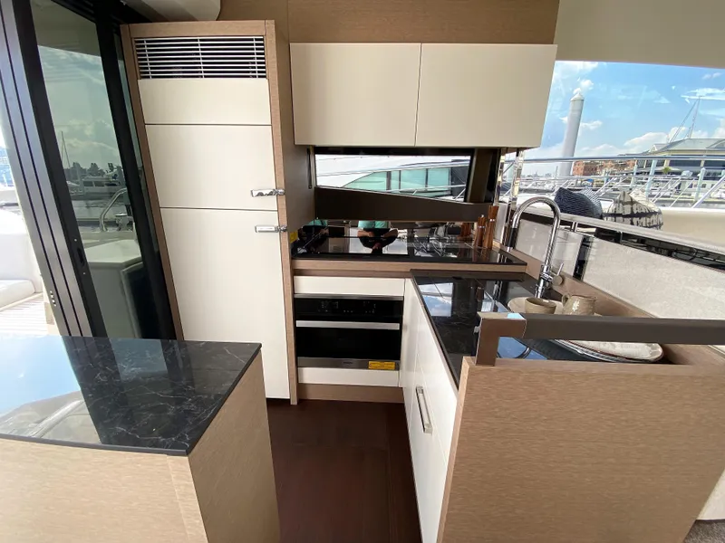 Slide: The Image of Modern kitchen interior on a 2025 Prestige 520 S yacht with sleek countertops. - 8