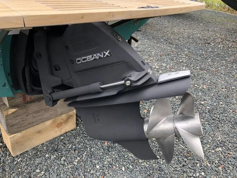 Slide: The Image of 2004 Medeiros Limestone 24 Cuddy Cabin boat with OceanX outdrive and propeller. - 20