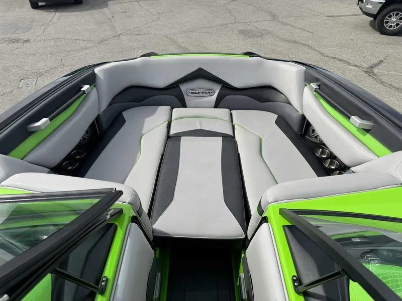 Slide: The Image of 2018 Supra SA450 boat interior with green and gray seating, showcasing modern design. - 4