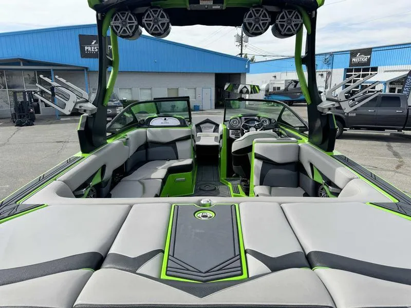 Slide: The Image of 2018 Supra SA450 boat interior with green accents and modern design. - 8