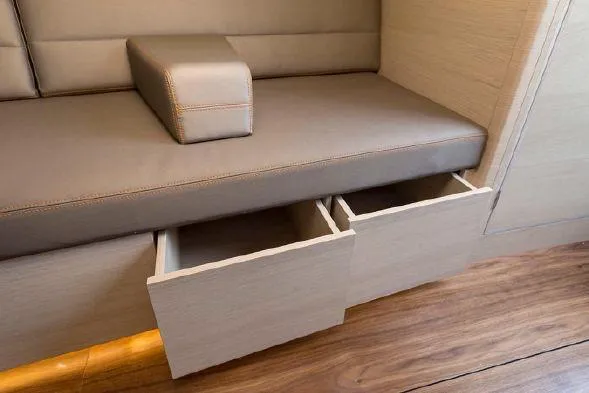 Slide: The Image of Saffier Se 37 Lounge 2026 interior with open storage drawers and cushioned seating. - 10