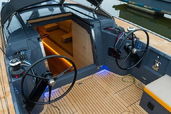 Slide: The Image of 2026 Saffier Se 37 Lounge yacht cockpit with dual steering wheels and cozy interior view. - 5