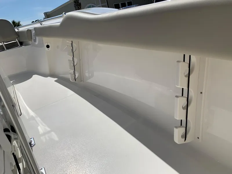Slide: The Image of 2024 Key West 219 FS boat interior with rod holders and white finish. - 12