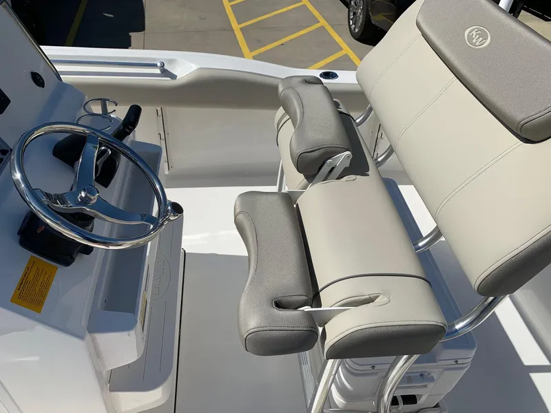 Slide: The Image of 2024 Key West 219 FS boat helm with dual seating and steering wheel. - 16