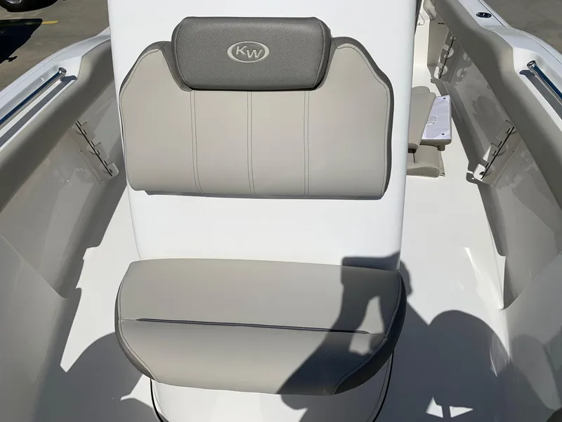 Slide: The Image of 2024 Key West 219 FS boat seat with gray and white upholstery. - 19