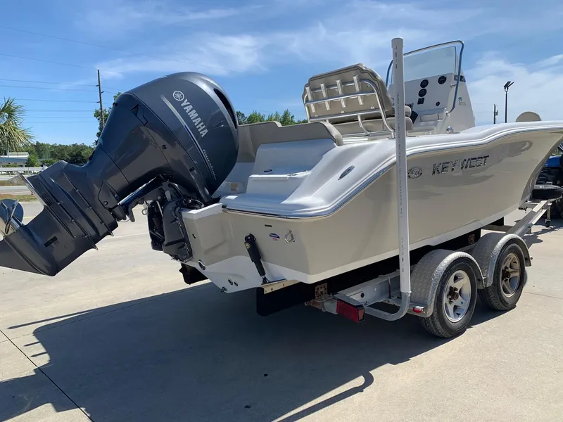 Slide: The Image of 2024 Key West 219 FS boat on trailer with Yamaha outboard motor. - 2