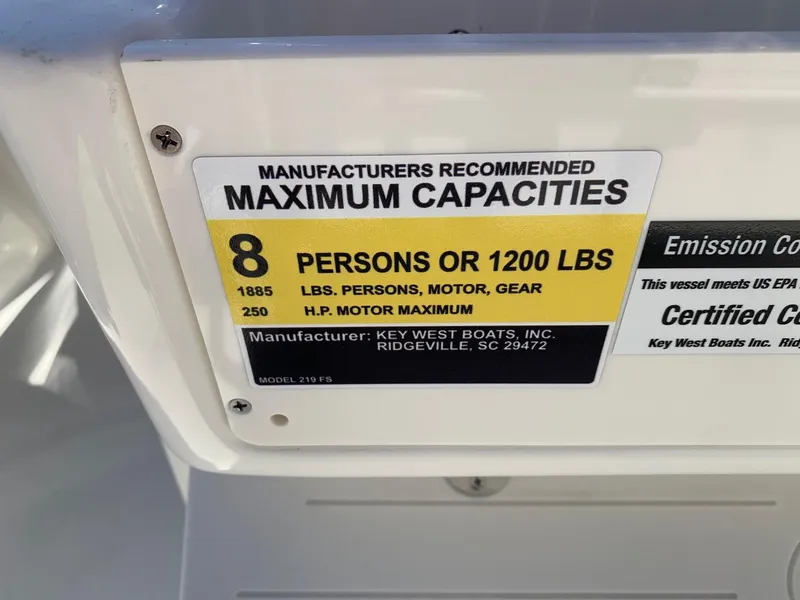 Slide: The Image of 2024 Key West 219 FS boat capacity label: 8 persons or 1200 lbs, 250 HP motor max. - 23
