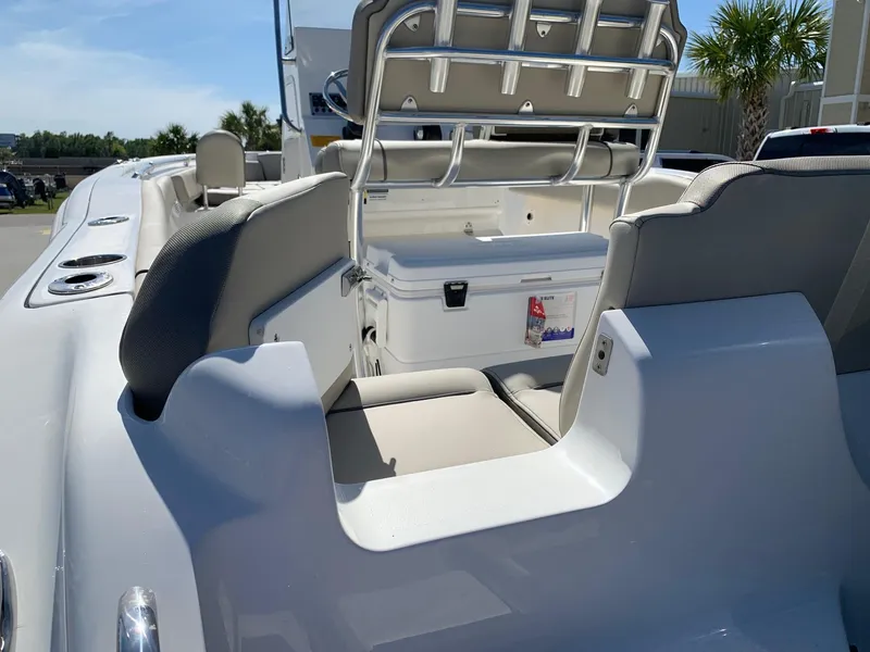 Slide: The Image of 2024 Key West 219 FS boat interior with seating and cooler. - 8