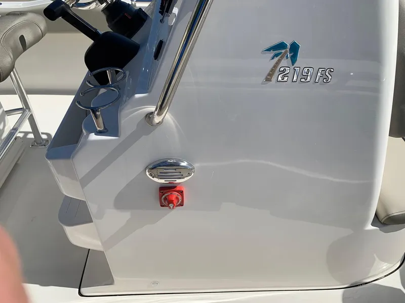 Slide: The Image of 2024 Key West 219 FS boat console with controls and logo. - 9