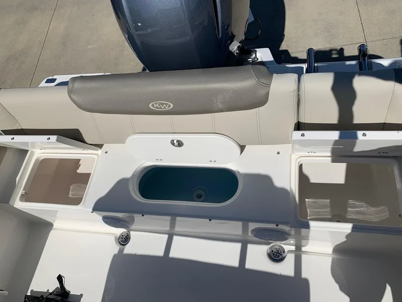 Slide: The Image of 2024 Key West 219 FS boat stern with seating and storage compartments. - 13