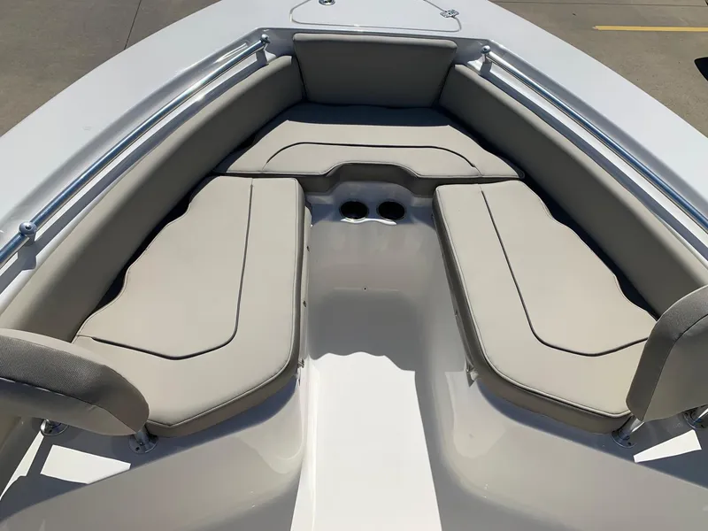 Slide: The Image of 2024 Key West 219 FS boat with cushioned seating area. - 22