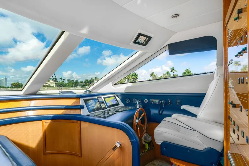 Slide: The Image of Interior helm of 2001 Azimut Sea Jet yacht with panoramic windows and modern controls. - 10