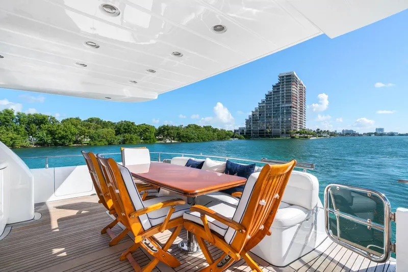 Slide: The Image of Luxury deck of 2001 Azimut Sea Jet yacht with ocean view and modern seating. - 12