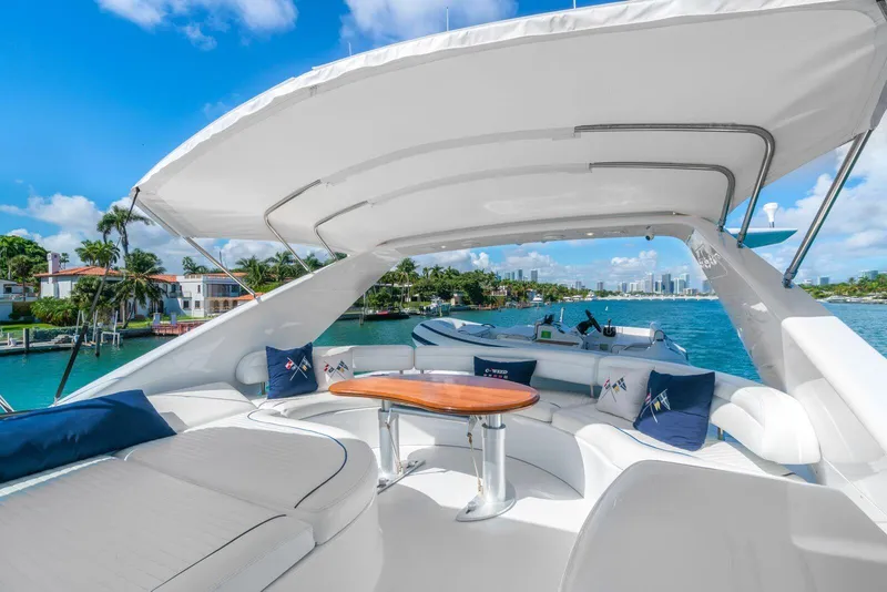 Slide: The Image of Luxurious 2001 Azimut Sea Jet yacht with spacious deck and scenic waterfront view. - 13