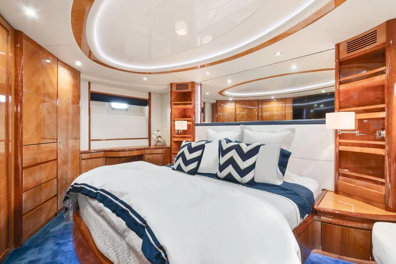 Slide: The Image of Luxurious bedroom interior of 2001 Azimut Sea Jet yacht with modern design and elegant wood finishes. - 4