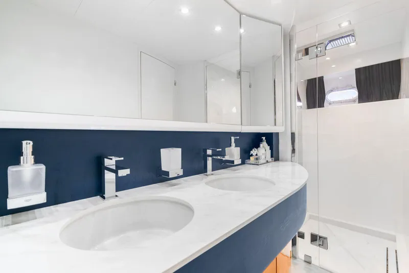 Slide: The Image of Luxurious bathroom in a 2001 Azimut Sea Jet yacht with dual sinks and modern fixtures. - 5