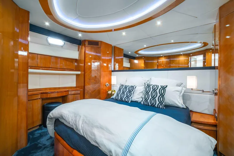 Slide: The Image of Luxurious bedroom interior of 2001 Azimut Sea Jet yacht with modern lighting and wooden finishes. - 6