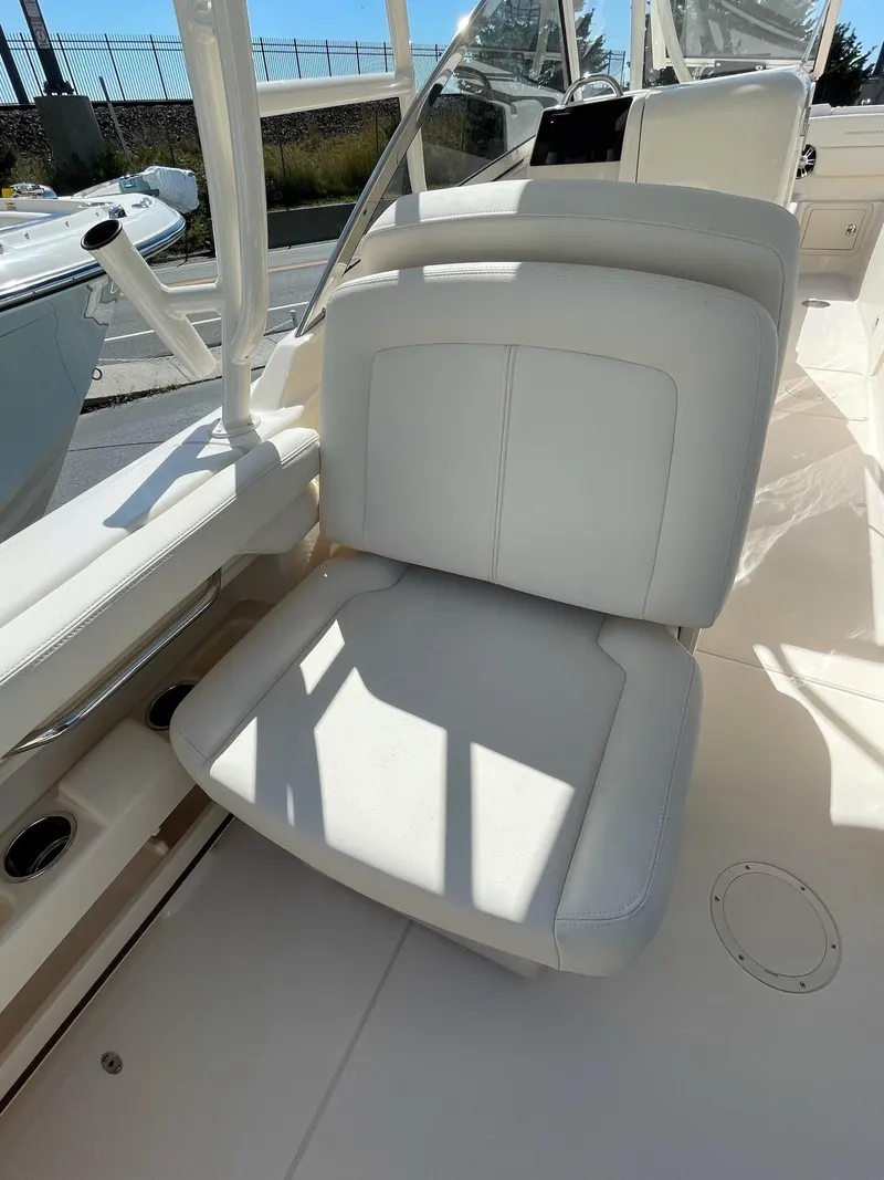 Slide: The Image of 2024 Grady-White Freedom 275 boat interior seating. - 6