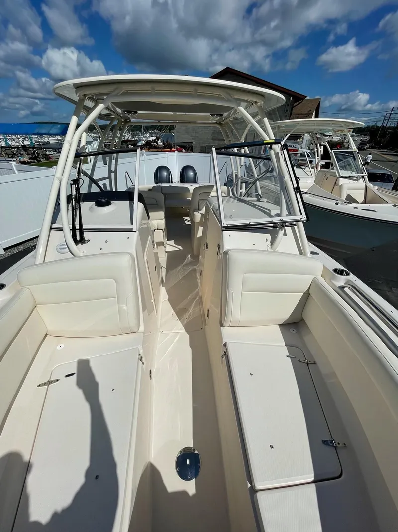 Slide: The Image of 2024 Grady-White Freedom 275 boat with dual console and spacious seating. - 9