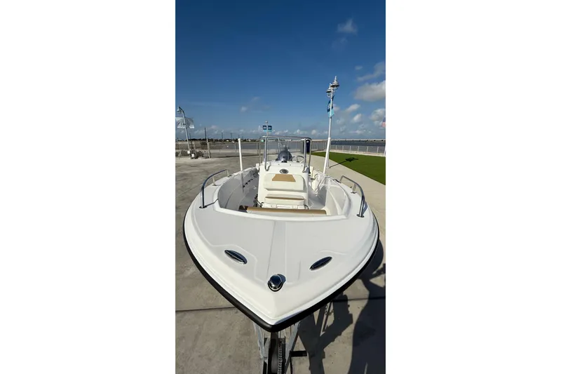 Slide: The Image of 2024 Edgewater 170CC boat on display under clear blue sky. - 15