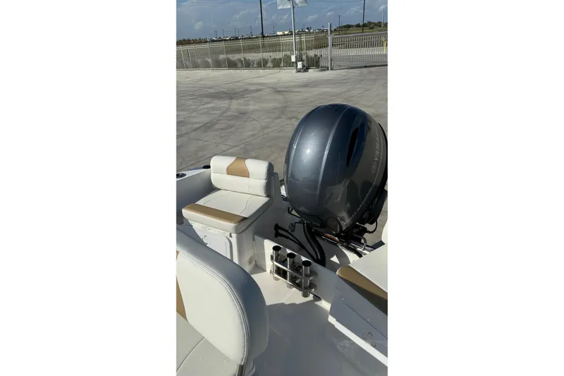 Slide: The Image of 2024 Edgewater 170CC boat interior with Yamaha outboard motor, featuring cushioned seating. - 17