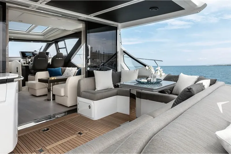 Slide: The Image of Luxurious 2023 Azimut S6 Sportfly yacht interior with elegant seating and ocean view. - 4