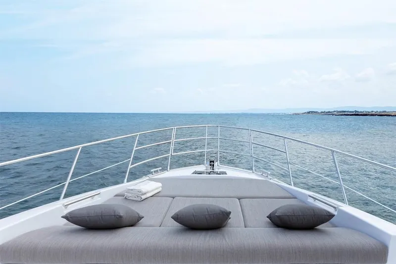 Slide: The Image of 2023 Azimut S6 Sportfly yacht bow with cushions and ocean view. - 7