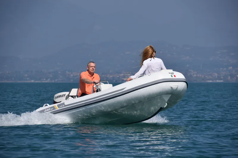 Slide: The Image of 2023 ZAR Mini LUX 12 inflatable boat cruising on a calm lake. - 5