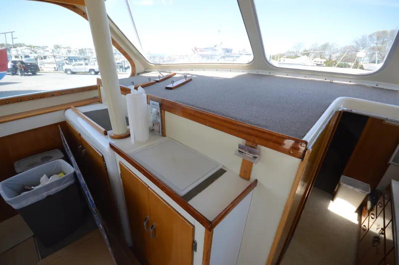 Slide: The Image of Interior of 1961 Hatteras 41 Convertible boat with wooden cabinets and countertop. - 25