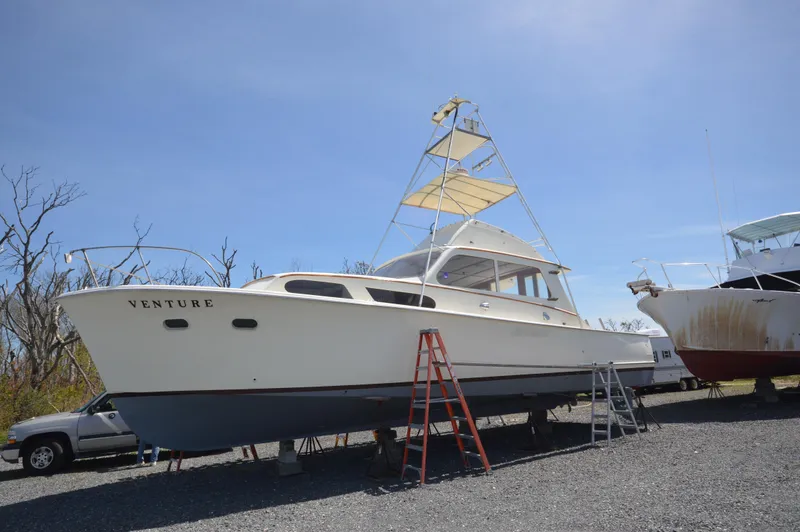 Slide: The Image of 1961 Hatteras 41 Convertible boat on dry dock with ladders. - 7