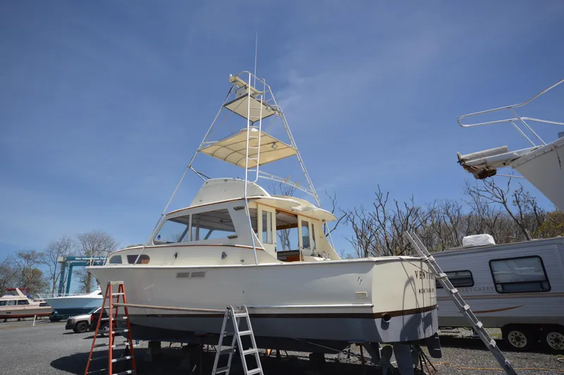 Slide: The Image of 1961 Hatteras 41 Convertible boat on dry dock with ladders. - 8