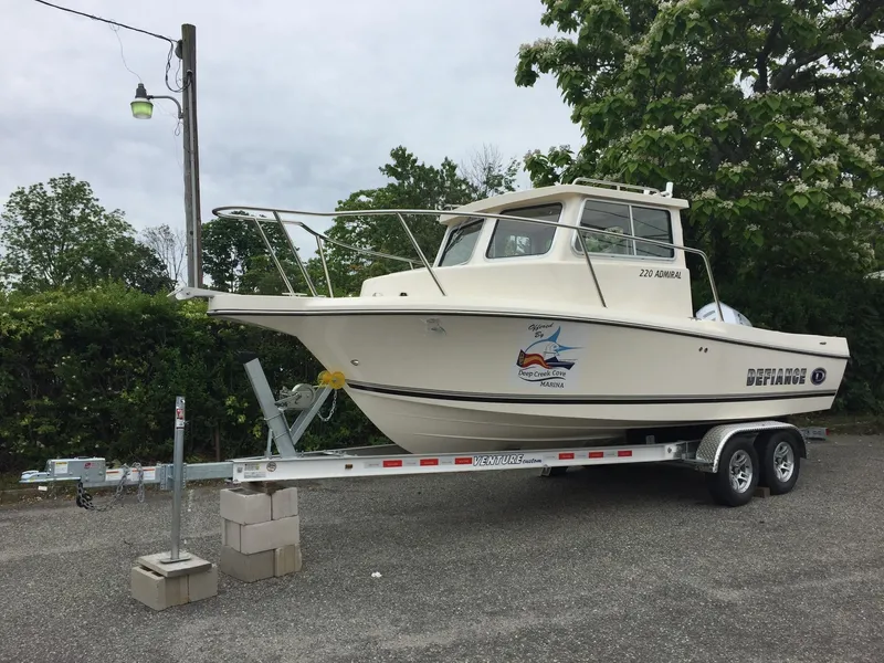 The Image of 2017 Defiance Admiral 220 NT boat on trailer, side view. - 1