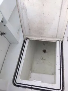 Slide: The Image of Open storage compartment on 1996 Hatteras SPORTFISH EXPRESS boat. - 12