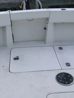 Slide: The Image of 1996 Hatteras SPORTFISH EXPRESS boat deck with storage compartments and fittings. - 13