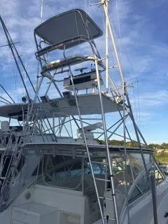 Slide: The Image of 1996 Hatteras SPORTFISH EXPRESS boat with tower against blue sky. - 5