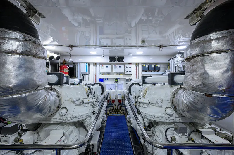 Slide: The Image of Engine room of 2013 Ocean Alexander Sky Lounge yacht, featuring dual engines and control panels. - 102