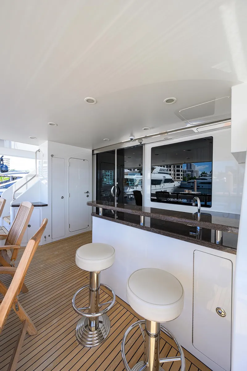 Slide: The Image of Luxurious 2013 Ocean Alexander Sky Lounge yacht with sleek bar and seating area. - 20