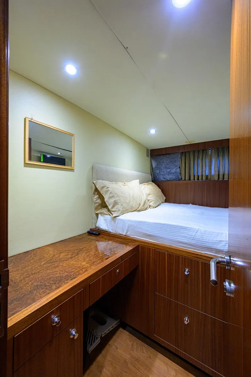 Slide: The Image of Luxurious cabin interior of 2013 Ocean Alexander Sky Lounge yacht with wood finish and cozy bed. - 23