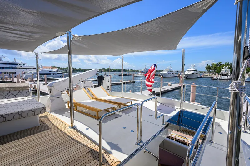 Slide: The Image of Luxurious 2013 Ocean Alexander Sky Lounge yacht with sun loungers and marina view. - 29