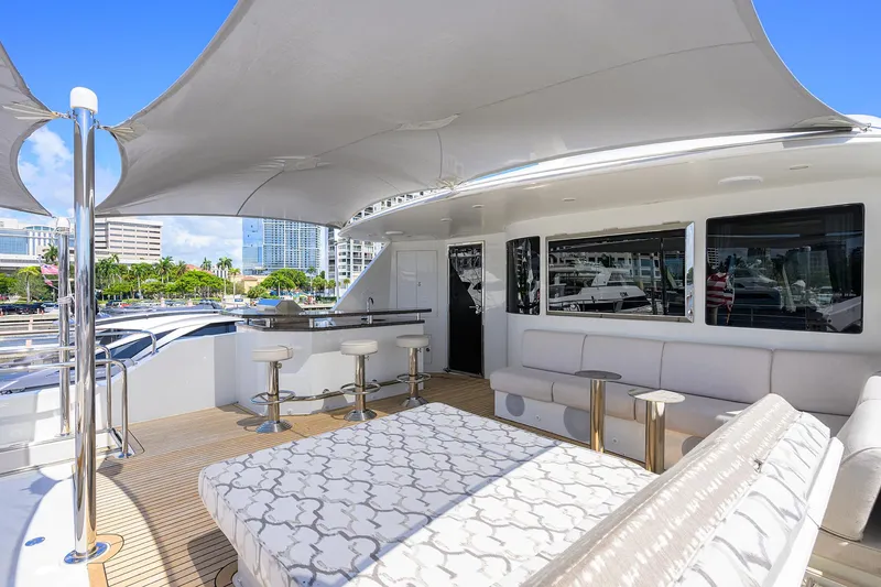 Slide: The Image of Luxurious 2013 Ocean Alexander Sky Lounge yacht with spacious deck, bar stools, and elegant seating. - 41