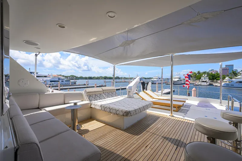 Slide: The Image of Luxurious 2013 Ocean Alexander Sky Lounge yacht deck with seating, sunbeds, and waterfront view. - 47