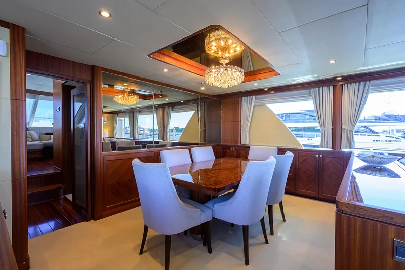 Slide: The Image of Luxurious dining area on 2013 Ocean Alexander Sky Lounge yacht with elegant chandelier. - 48