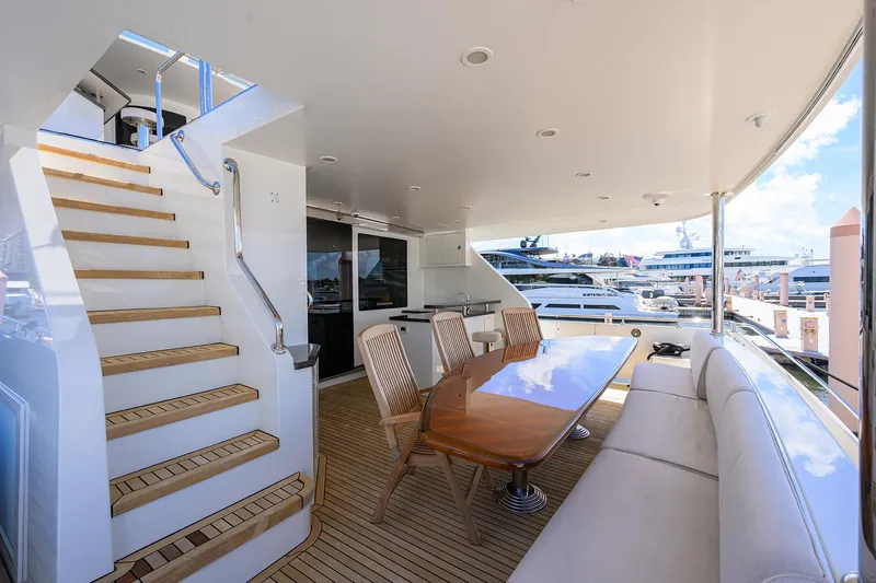 Slide: The Image of Luxurious 2013 Ocean Alexander Sky Lounge yacht with elegant outdoor seating and dining area. - 5