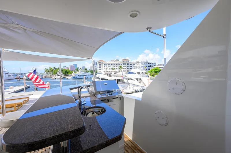 Slide: The Image of Luxurious 2013 Ocean Alexander Sky Lounge yacht with outdoor kitchen and marina view. - 50