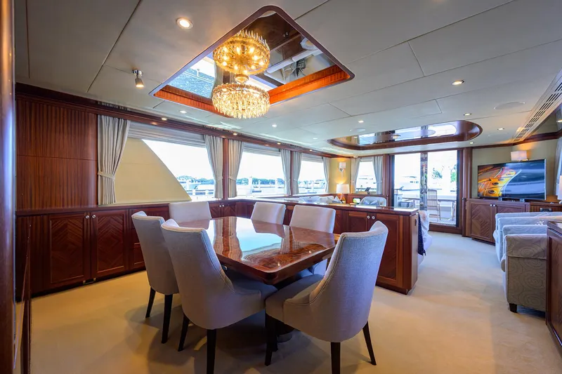 Slide: The Image of Luxurious interior of 2013 Ocean Alexander Sky Lounge yacht with elegant dining area and chandelier. - 53