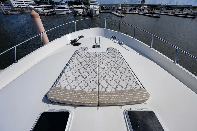Slide: The Image of 2013 Ocean Alexander Sky Lounge yacht with patterned sunbathing cushions at marina. - 60