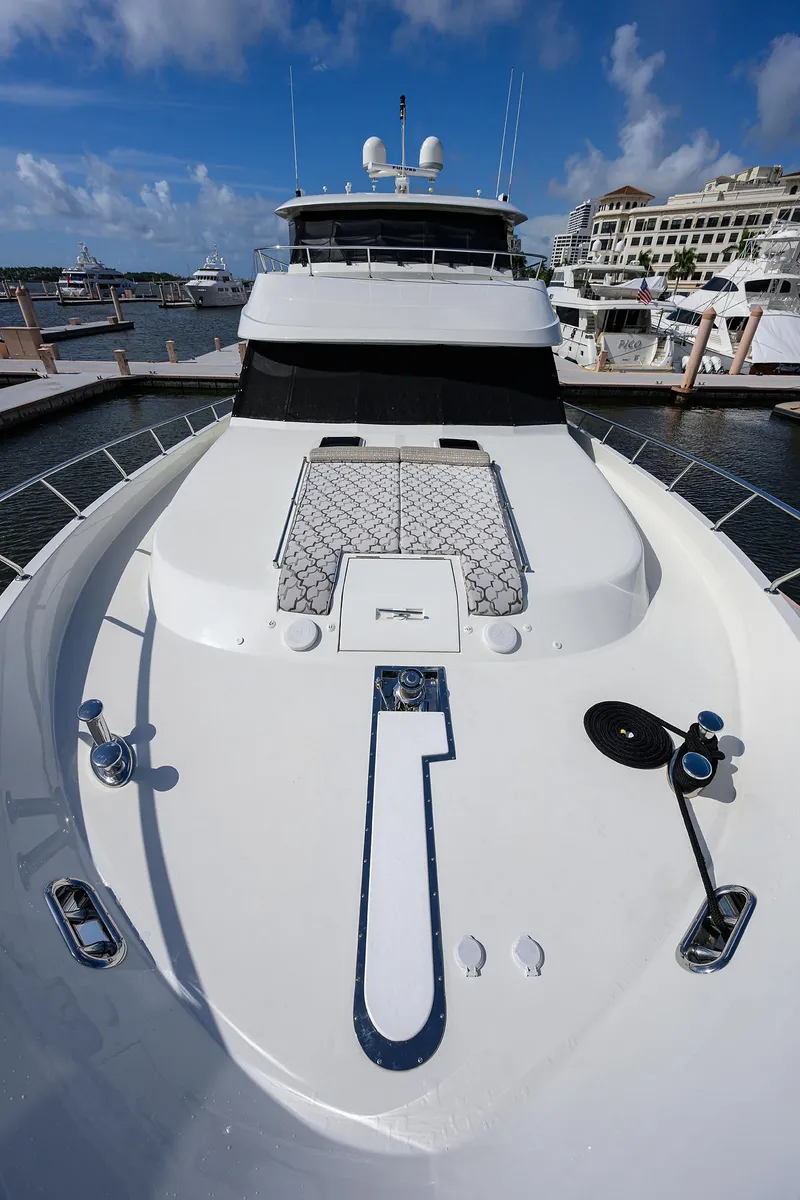 Slide: The Image of 2013 Ocean Alexander Sky Lounge yacht docked at marina under clear blue sky. - 64